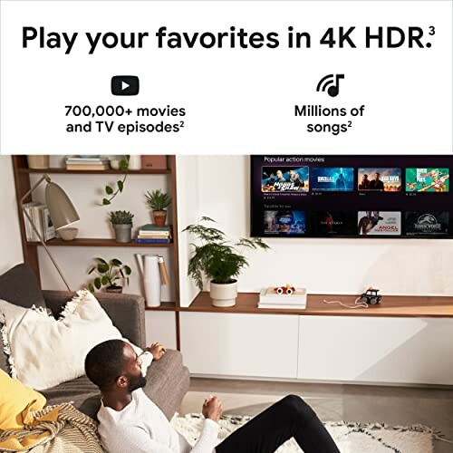 Man relaxing in living room, watching TV with 4K HDR streaming service.