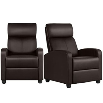 Two brown leather recliner chairs in a cozy living room.