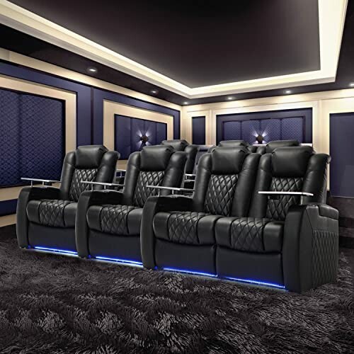 Luxury home theater seating with black leather recliners and ambient lighting.