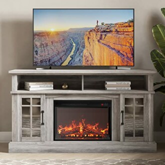 Modern TV stand with built-in fireplace and large flat-screen TV.