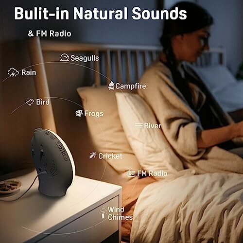 Person in bedroom with natural sounds machine on table.