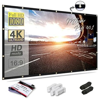 Projector screen with highway sunset image and accessories.