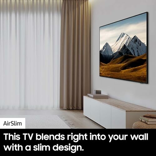 Slim TV on wall with mountain landscape