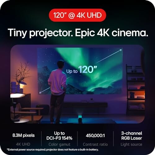 Man watching a large 120 inch 4K projector display in a living room.